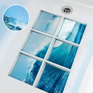 Closeup view of blue ocean wave pattern anti slip bathtub stickers with textured frosted surface.