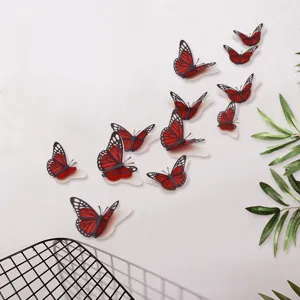 3D holle parelmoer papier vlinder muursticker in rood en zwart voor thuisdecoratie.
