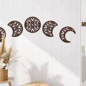 Wooden hollow moon phase wall hanging detail, exquisite carved scrollwork art decoration.