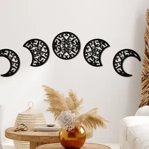 Wooden moon phase wall art set, hollow carved hanging decor for bohemian home interior.
