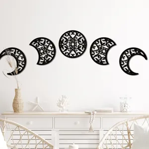 Wooden hollow moon phase wall hanging detail, aesthetic black wood wall decor for home living room.