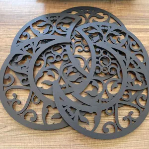 Detailed view of hollow wooden moon phase wall decor, featuring intricate laser-cut designs.