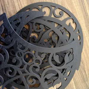 Close-up of black hollow wooden moon phase wall art panels showing intricate details.