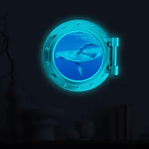 Glow in the dark whale porthole wall sticker, detail view showing bright cyan luminous effect.