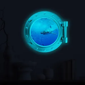 Glow in the dark porthole wall sticker, underwater shark design for kids room decor.