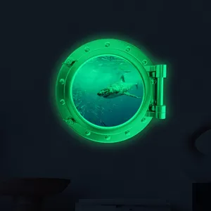 Luminous porthole wall sticker featuring a shark design, perfect for kids room and home decor.