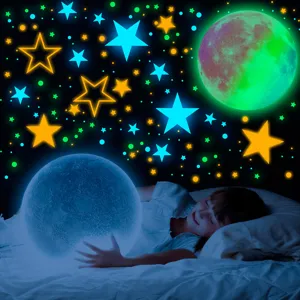 Glow in the dark wall stickers detail showing luminous stars and moon in a cozy kids bedroom setting