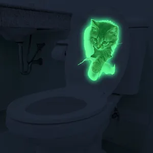 Luminous 3D cat toilet sticker glow in the dark wall decal for bathroom home decor.