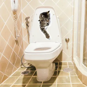 Detail view of 3D funny cat toilet sticker applied on white lid, perfect home bathroom decor.
