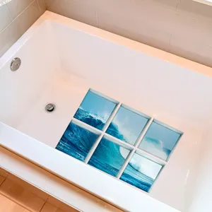 Detailed view of anti-slip bathtub stickers featuring a vibrant ocean wave pattern for safety.