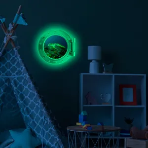 Glow in the dark porthole wall sticker featuring ocean turtle scene, perfect for kids room decor.