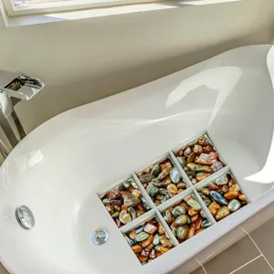 Detailed close-up view of decorative pebble pattern anti-slip bathtub stickers for bathroom safety.