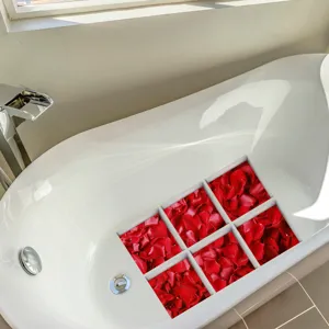 Waterproof anti-slip bathtub stickers with red rose petals, secure non-slip shower safety strips for bathroom tubs and floors.