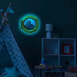 Detailed scene view of the luminous dolphin porthole wall sticker glowing in a dark child room.