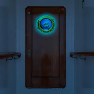 Glow in the dark porthole wall sticker with marine turtle design for home room decor.