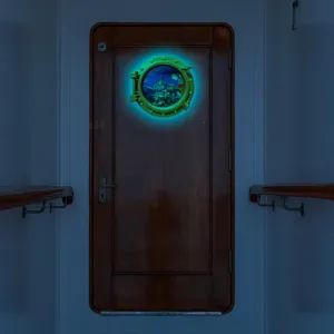 Luminous porthole wall sticker featuring ocean animals, glow in dark decor for home door.