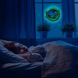 Glow in the dark porthole wall sticker showing ocean marine life in a cozy kids bedroom