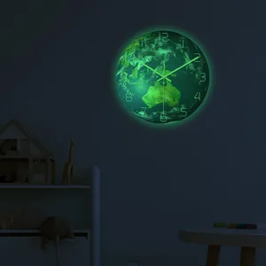 Luminous earth wall clock glowing in dark, detail view showing fluorescent numbers and continents.
