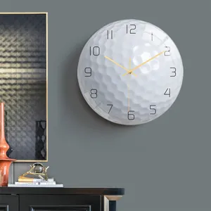 Golf ball wall clock detail shot, acrylic silent decorative clock for modern room decor.