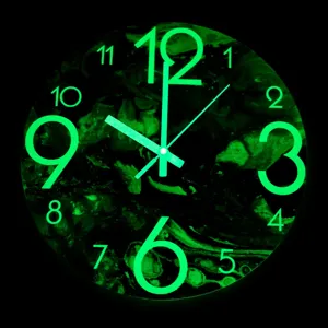 Luminous wall clock with glowing green numbers and silent movement for home decor.