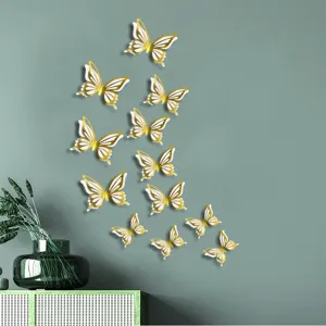 Detailed view of 3D gold hollow butterfly wall stickers, elegant dual layer decor for home.