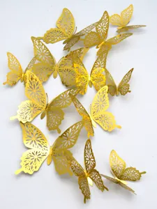 Gold 3D metallic butterfly wall stickers detail, hollow floral pattern home decor.