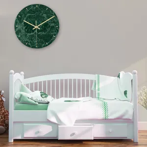 Scene detail of minimalist green marble wall clock hanging in modern bedroom interior.