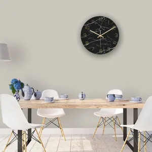 Minimalist black marble wall clock with gold numbers and hands, modern silent decor for living room.