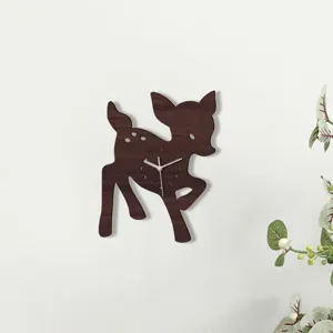 Wooden deer shaped wall clock detail showing quiet movement and white hands on wall.