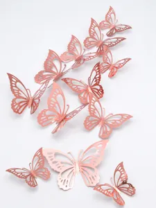 Close-up detail of rose gold 3D hollow butterfly wall stickers, showing delicate patterns.