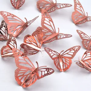 Rose gold 3D hollow metallic butterfly wall stickers, perfect for home decoration.