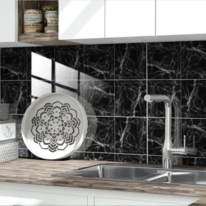 Detail view of the black marble pattern crystal tile sticker installed in the modern kitchen.