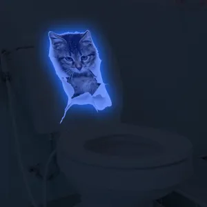 Luminous 3D cat toilet sticker wall decal glowing in dark home bathroom decoration details.