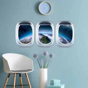 Autocollant mural hublot d'avion lumineux design espace terre pour decor chambre d'enfant.