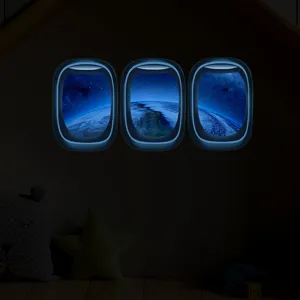Adhesif mural lumineux hublot d'avion pour decor de chambre d'enfant, espace terre phosphores.