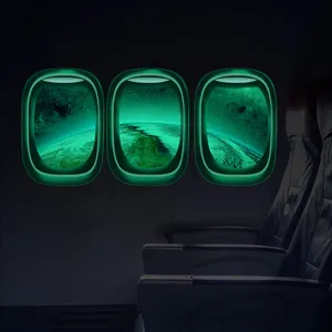 Sticker mural hublot avion luminescent motif espace terre decoration chambre d'enfant.