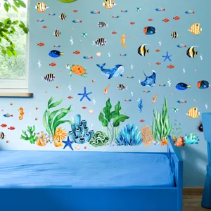 Ocean theme wall stickers detail showing cute watercolor fish and whale in children bedroom.