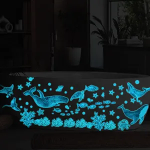 Glow in the dark ocean animal wall stickers detail shot showing glowing whales and fish in room.