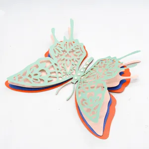 Detailed view of 3D hollow butterfly wall stickers, multi-layer pearl paper decor for events.
