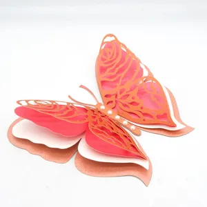 Detailed close-up view of 3D layered hollow pearlescent paper butterfly wall sticker decor.
