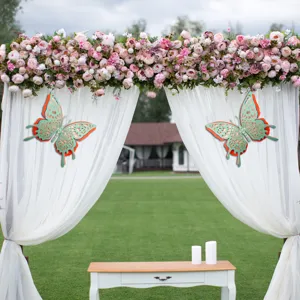 Detailed view of 3D hollow butterfly wall stickers, multi-layer pearl paper decor for wedding.