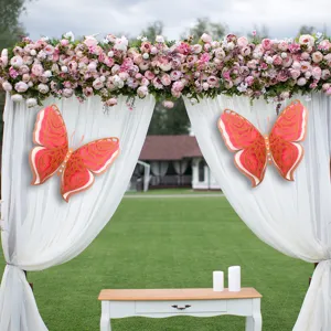 Scene detail showing large 3D hollow butterfly wall stickers decorating a wedding arch.