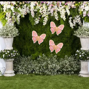 3D layered hollow pearlescent paper butterflies for wedding wall decor and party backdrop.