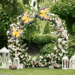 Outdoor scene detail shot of large 3D hollow butterfly wall stickers on floral arch.