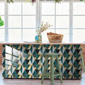 Close-up scene showing geometric marble tile sticker applied on modern counter surface.