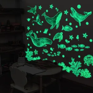 Glow in the dark ocean wall stickers featuring whales, turtles, and coral reef designs for kids.