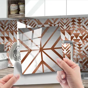 Close-up detail of geometric marble tile sticker showing copper lines and glossy surface.