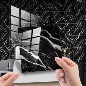 Black marble tile sticker detail shot, showing peeling backing adhesive for easy wall decor.
