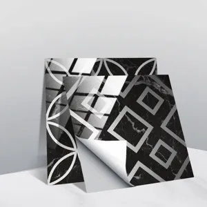 Detail view of black marble geometric tile stickers showing peeling backing paper and crystal film.