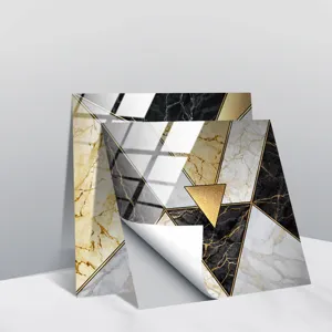 Detail shot of modern geometric marble tile sticker with gold lines and peel-off backing.